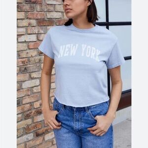 Brandy Melville light blue raw hem New York tee